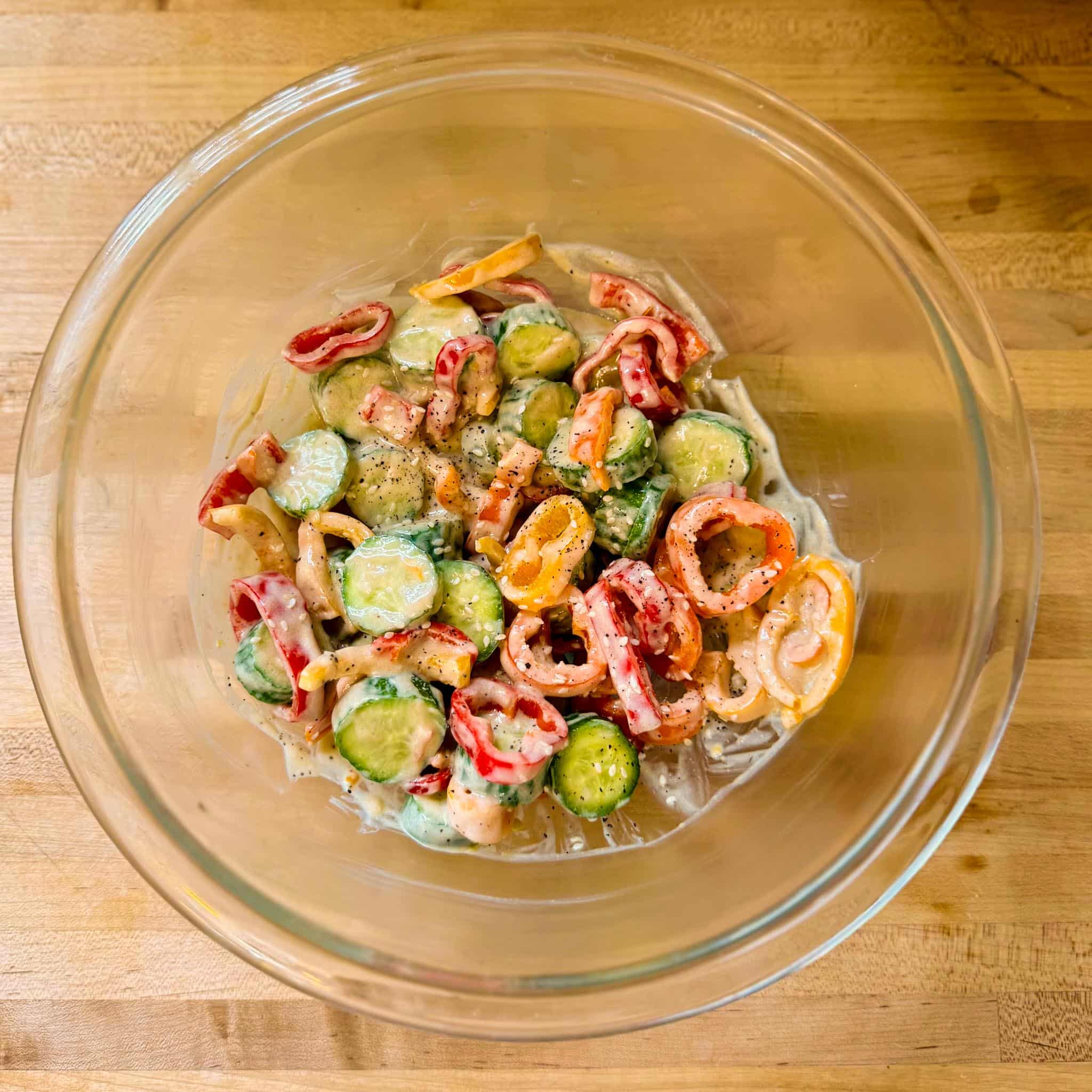 Cool, Crisp, and Bursting with Flavor: Cucumber & Bell Pepper Salad with AOOC Toasted Sesame Dressing